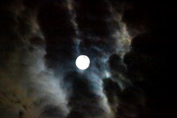 Full moon with clouds in an eerie sky, full Sturgeon Moon