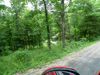 Road to the property. it's quite a hill. You can barely see the house on the left.