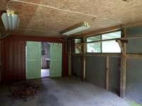 "shed" closer to the guest cottage. No door. Cement floor.measures 16x12, only 6' high though.