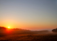 Sunrise in eastern oklahoma, a bridge disappears into the fog