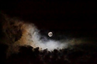 Full moon with colorful clouds, copy space in top