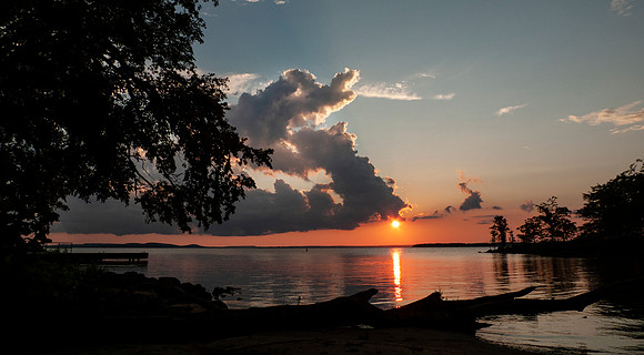 Sunset at on the lake with cloudscape