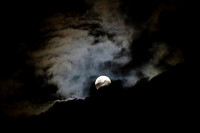 Full moon with clouds in an eerie sky