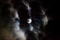 Full moon with clouds in an eerie sky, full Sturgeon Moon