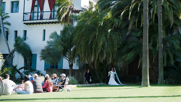 Santa Barbara Courthouse, a bride approaches her wedding as peop