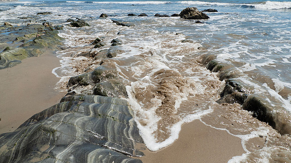 Arroyo Burro Beach, Santa Barbara, features rocks in the sand