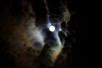Full moon with clouds in an eerie sky