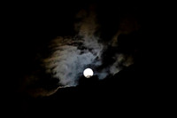 Full moon with clouds in an eerie sky