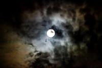 Full moon astral sky with colorful clouds