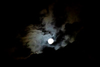 Full moon with clouds in an eerie sky