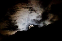 Full moon with clouds in an eerie sky