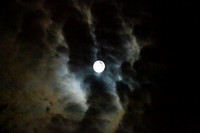 Full moon with clouds in an eerie sky, full Sturgeon Moon