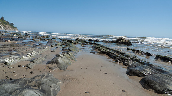 Arroyo Burro Beach, Santa Barbara, features rocks in the sand