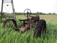 Old tractor parked in a field